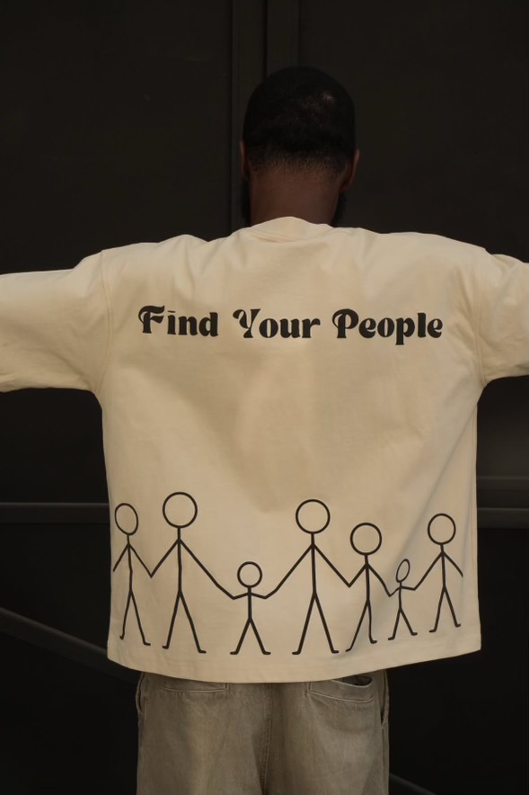 Back of the cream Find Your People tee with stick-figure family artwork